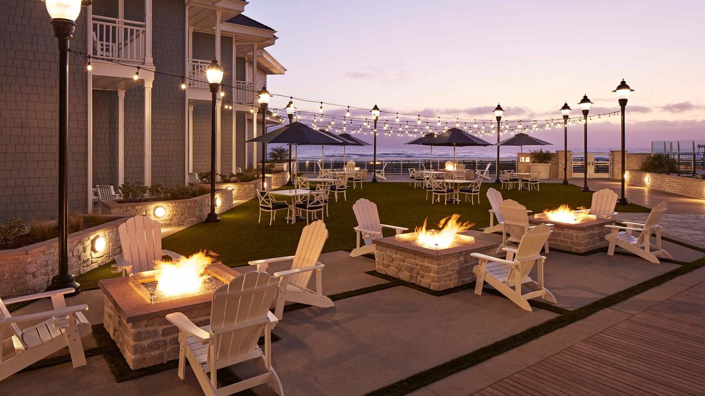 Sunset firepits on the oceanfront patio at Vespera Resort