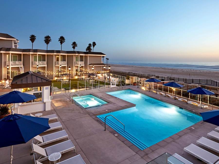 Oceanfront pool at dusk at Vespera Resort